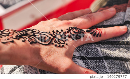 Hand showing intricate mehndi design during India Day celebration in Moscow Hand showing intricate mehndi design during India Day celebration in Moscow 140279777