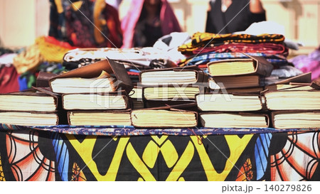 Leather religious Indian books on a street shop table in India. Leather religious Indian books on a street shop table in India. 140279826