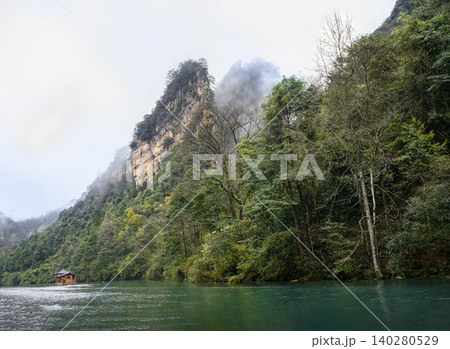 View of the peaks of the mountains in the fog on Lake Baofeng in the vicinity of Zhangjiajie, China 140280529