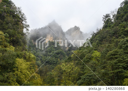 View of the peaks of the mountains in the fog in the vicinity of Zhangjiajie, China 140280868