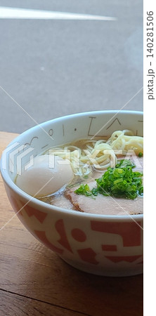 A steaming bowl of ramen with rich broth, tender noodles, sliced pork, boiled egg, nori, and fresh green onions. A comforting and flavorful Japanese classic. A steaming bowl of ramen with rich broth, tender noodles, sliced pork, boiled egg, nori, and fresh green onions. A comforting and flavorful Japanese classic. 140281506