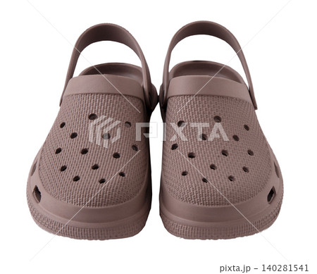 Pair brown rubber clogs isolated on white background Pair brown rubber clogs isolated on white background 140281541