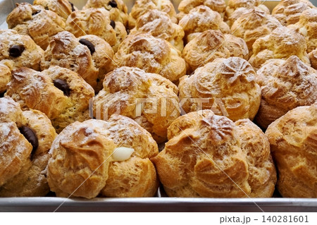 Light and airy choux pastry with a golden crust, filled with rich cream or custard. This elegant and versatile dessert offers a perfect balance of texture and sweetness. Light and airy choux pastry with a golden crust, filled with rich cream or custard. This elegant and versatile dessert offers a perfect balance of texture and sweetness. 140281601