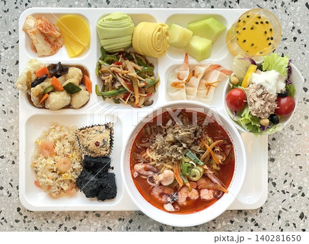 A vibrant spread of Korean food on the table, featuring various banchan (side dishes) like kimchi, pickled vegetables, and seasoned greens. Perfect for food photography, showcasing traditional Korean. A vibrant spread of Korean food on the table, featuring various banchan (side dishes) like kimchi, pickled vegetables, and seasoned greens. Perfect for food photography, showcasing traditional Korean. 140281650