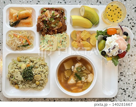A vibrant spread of Korean food on the table, featuring various banchan (side dishes) like kimchi, pickled vegetables, and seasoned greens. Perfect for food photography, showcasing traditional Korean. 140281667