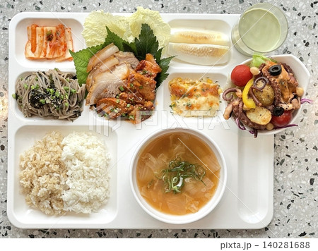 A vibrant spread of Korean food on the table, featuring various banchan (side dishes) like kimchi, pickled vegetables, and seasoned greens. Perfect for food photography, showcasing traditional Korean. A vibrant spread of Korean food on the table, featuring various banchan (side dishes) like kimchi, pickled vegetables, and seasoned greens. Perfect for food photography, showcasing traditional Korean. 140281688