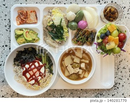 A vibrant spread of Korean food on the table, featuring various banchan (side dishes) like kimchi, pickled vegetables, and seasoned greens. Perfect for food photography, showcasing traditional Korean. A vibrant spread of Korean food on the table, featuring various banchan (side dishes) like kimchi, pickled vegetables, and seasoned greens. Perfect for food photography, showcasing traditional Korean. 140281770