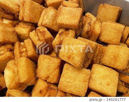 Menbosha shrimp toast with golden crispy bread enclosing tender shrimp filling, highlighting crunchy texture, juicy interior, and rich golden-brown color in close-up appetizing detail Menbosha shrimp toast with golden crispy bread enclosing tender shrimp filling, highlighting crunchy texture, juicy interior, and rich golden-brown color in close-up appetizing detail 140281777