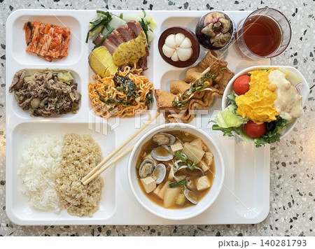 A vibrant spread of Korean food on the table, featuring various banchan (side dishes) like kimchi, pickled vegetables, and seasoned greens. Perfect for food photography, showcasing traditional Korean. A vibrant spread of Korean food on the table, featuring various banchan (side dishes) like kimchi, pickled vegetables, and seasoned greens. Perfect for food photography, showcasing traditional Korean. 140281793