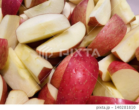 Freshly sliced apple pieces with crisp texture and natural sweetness, beautifully arranged. A healthy and refreshing snack perfect for any time of the day. Freshly sliced apple pieces with crisp texture and natural sweetness, beautifully arranged. A healthy and refreshing snack perfect for any time of the day. 140281810