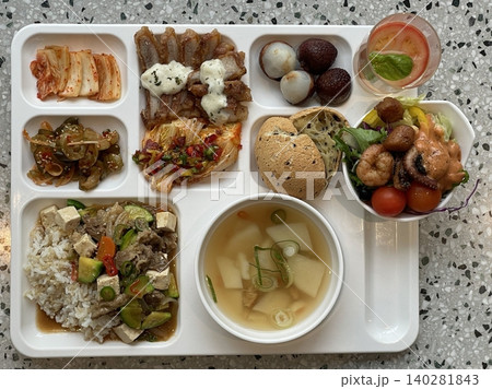 A vibrant spread of Korean food on the table, featuring various banchan (side dishes) like kimchi, pickled vegetables, and seasoned greens. Perfect for food photography, showcasing traditional Korean. A vibrant spread of Korean food on the table, featuring various banchan (side dishes) like kimchi, pickled vegetables, and seasoned greens. Perfect for food photography, showcasing traditional Korean. 140281843