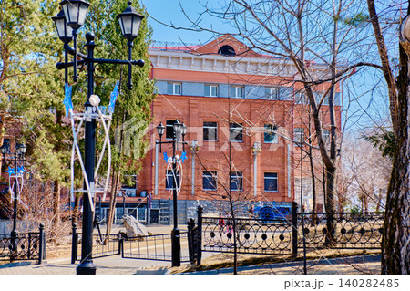 Historical brick building with wrought iron fence near Grodekov Museum in Khabarovsk Historical brick building with wrought iron fence near Grodekov Museum in Khabarovsk 140282485