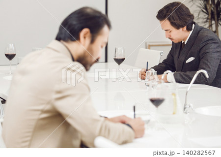 Aspiring Sommeliers at Wine Evaluation Class. School of Alcoholic Beverages Tasting. Courses of Preparation Professional Winemakers. Aspiring Sommeliers at Wine Evaluation Class. School of Alcoholic Beverages Tasting. Courses of Preparation Professional Winemakers. 140282567