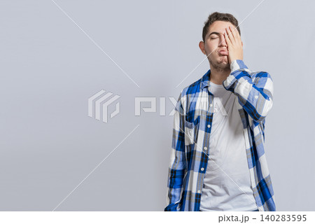 Exhausted person putting the palm of hand on his face. Tired and exhausted man covering his face with the palm hand isolated Exhausted person putting the palm of hand on his face. Tired and exhausted man covering his face with the palm hand isolated 140283595