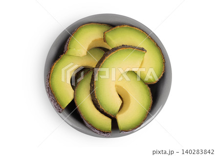 avocado pieces in ceramic bowl isolated on white background close up. Top view. Flat lay avocado pieces in ceramic bowl isolated on white background close up. Top view. Flat lay 140283842