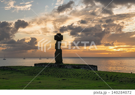 Serene moai statue on easter island chile overlooks majestic sunset ocean 140284072
