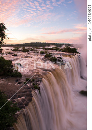 Breathtaking sunset sky over majestic nature landscape of iguazu falls Breathtaking sunset sky over majestic nature landscape of iguazu falls 140284091