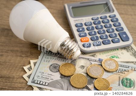 Cost of electric utilities with light bulb for payment. 140284626