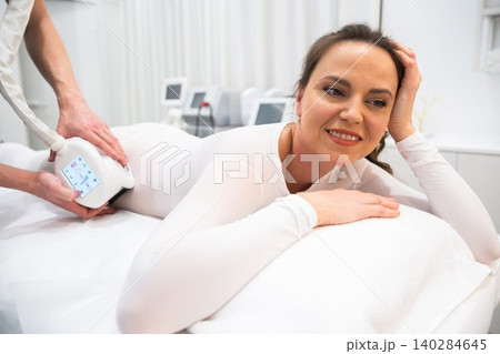 Beauty treatment session at a modern spa with patient receiving care 140284645