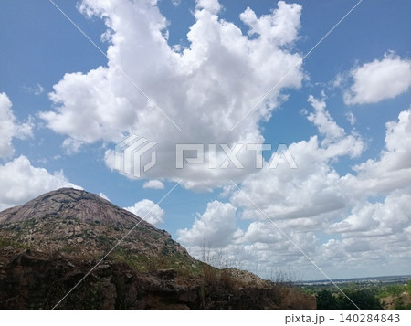 mountain landscape with clouds and sky, White clouds over rocky mountain ridge, Sunny sky above stone hill, Landscape with dramatic clouds mountain landscape with clouds and sky, White clouds over rocky mountain ridge, Sunny sky above stone hill, Landscape with dramatic clouds 140284843