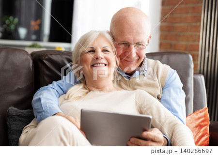 Senior couple browsing the internet together Senior couple browsing the internet together 140286697