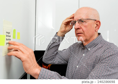 Elderly man with dementia has trouble remembering Elderly man with dementia has trouble remembering 140286698