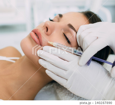 woman having lip injections, procedure lip augmentation woman having lip injections, procedure lip augmentation 140287890
