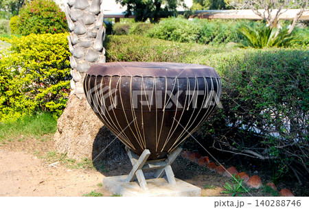 Large Traditional Drum Sculpture Displayed in Outdoor Park 140288746