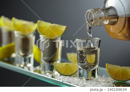 Tequila shots with salt and lime slices. 140289639