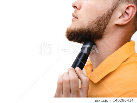 Man showing how to use a laryngophone after vocal cord removal or laryngeal injury. Electronic throatphone generates vibrations in human speech Man showing how to use a laryngophone after vocal cord removal or laryngeal injury. Electronic throatphone generates vibrations in human speech 140290414