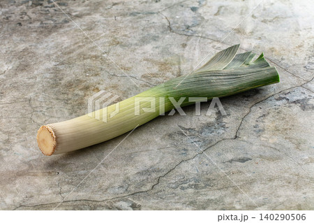 Fresh Leek on Textured Stone Background Fresh Leek on Textured Stone Background 140290506