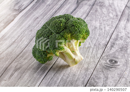 Fresh green broccoli floret on rustic wooden table Fresh green broccoli floret on rustic wooden table 140290507