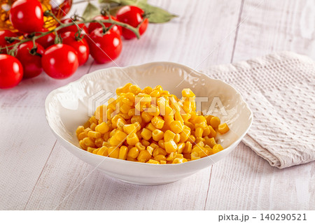 Bowl of sweet corn kernels with cherry tomatoes on vine Bowl of sweet corn kernels with cherry tomatoes on vine 140290521
