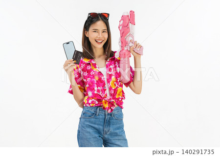 Young Asian woman in summer wearing floral shirt holding smartphone mockup of blank screen and credit card on white background. 140291735