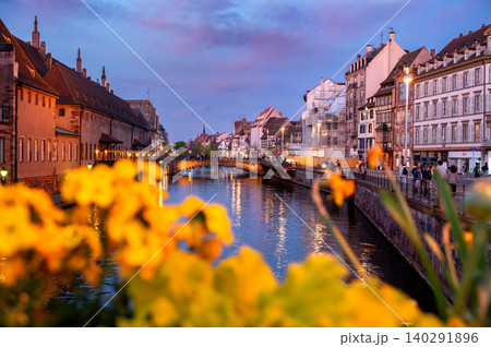Canal at Dusk With Yellow Flowers Framing Waterfront Canal at Dusk With Yellow Flowers Framing Waterfront 140291896