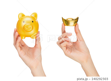 Clipping path, Hand holding yellow piggy bank and Chinese gold ingot on white background. Clipping path, Hand holding yellow piggy bank and Chinese gold ingot on white background. 140292303