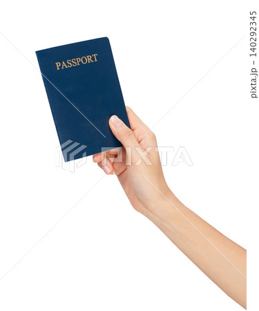 Hand holding passport isolated on white background for travel. 140292345