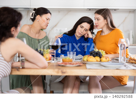 Group of female friends calming woman 140292588