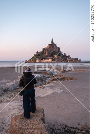 Girl Standing in Front of Mont-Saint-Michel, France 140292770