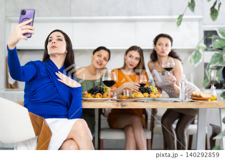 Spanish woman takes selfie with friends 140292859