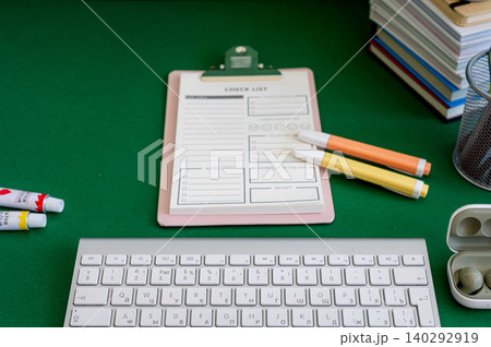 Colorful school supplies on a green background Colorful school supplies on a green background 140292919