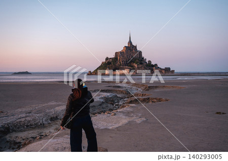 Girl Standing in Front of Mont-Saint-Michel, France 140293005
