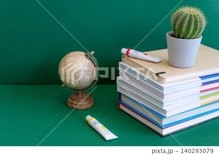 Colorful school supplies on a green background Colorful school supplies on a green background 140293079