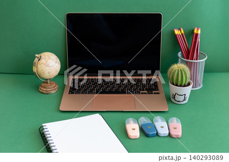 Colorful school supplies on a green background 140293089
