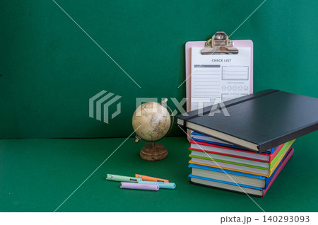 Colorful school supplies on a green background Colorful school supplies on a green background 140293093