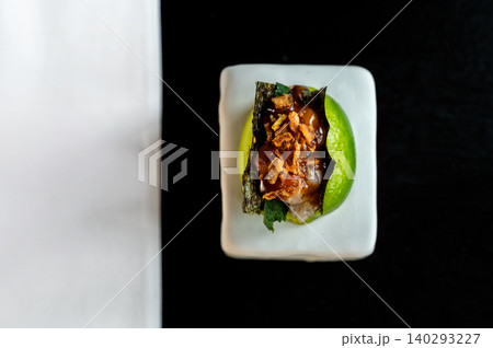 Elegant dish presentation. Striking food image showcasing caramel and nori details clearly Elegant dish presentation. Striking food image showcasing caramel and nori details clearly 140293227