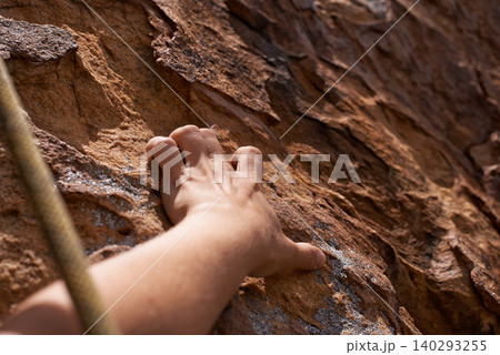 Person, hand and rock climber with rope on mountain for climbing, hiking or grip in extreme sports. Closeup of hiker or mountaineer grabbing patch, hole or pattern on natural surface for fitness Person, hand and rock climber with rope on mountain for climbing, hiking or grip in extreme sports. Closeup of hiker or mountaineer grabbing patch, hole or pattern on natural surface for fitness 140293255