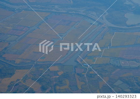 The view of China city from the airplane window. Aerial view of cityscape, the land of China, Asia. Travel and landscape scene. Travel and nature concept.  140293323