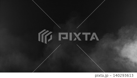 Soft white smoke drifting through dark background. Abstract fog texture ideal for cinematic overlays, visual effects, compositing, atmospheric scenes and creative video production. 140293613