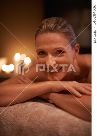 Female person, smile and spa for wellness, relax and self care and massage on table being happy. Woman, body treatment and portrait to destress, peace and detox for calm and holistic relaxation Female person, smile and spa for wellness, relax and self care and massage on table being happy. Woman, body treatment and portrait to destress, peace and detox for calm and holistic relaxation 140294036